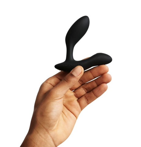 KSutra – We-Vibe Vector Black Held in Hand for Size Reference